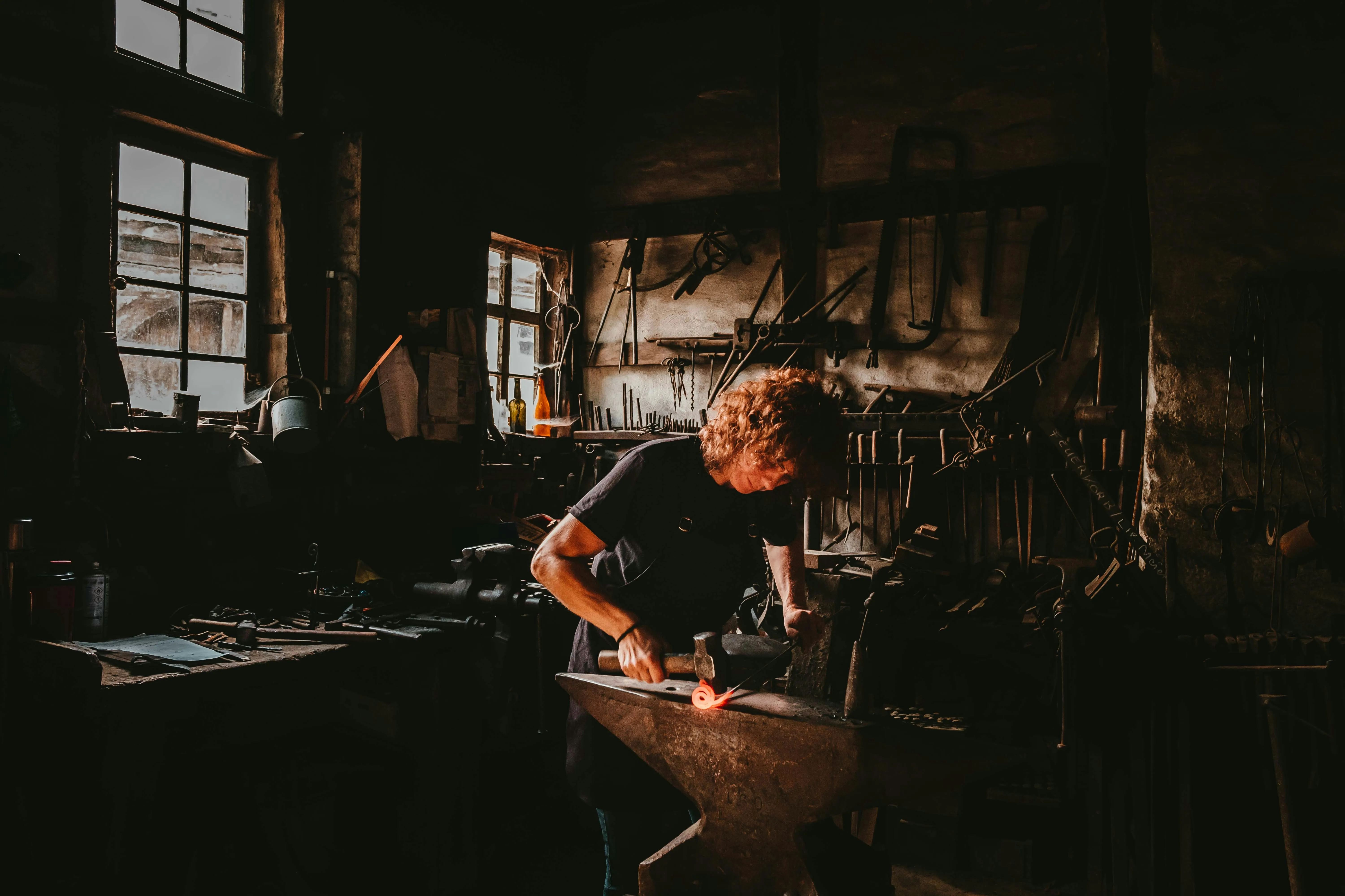 A person crafting a hammer